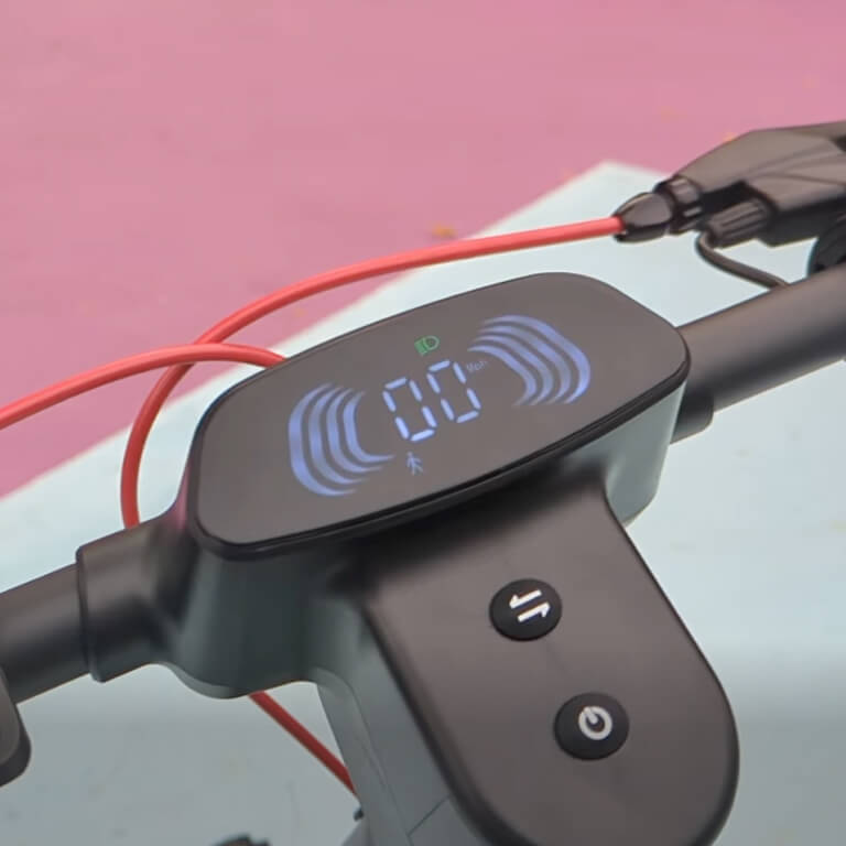 Digital display on a bicycle handlebar with wires and a pink background