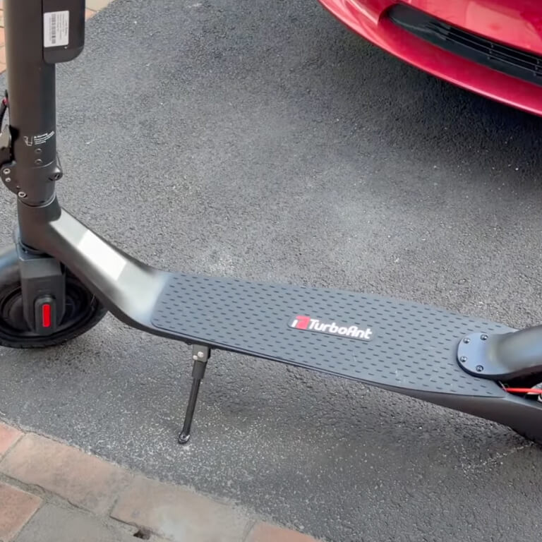 E-scooter with 'TurboArt' branding on a pavement